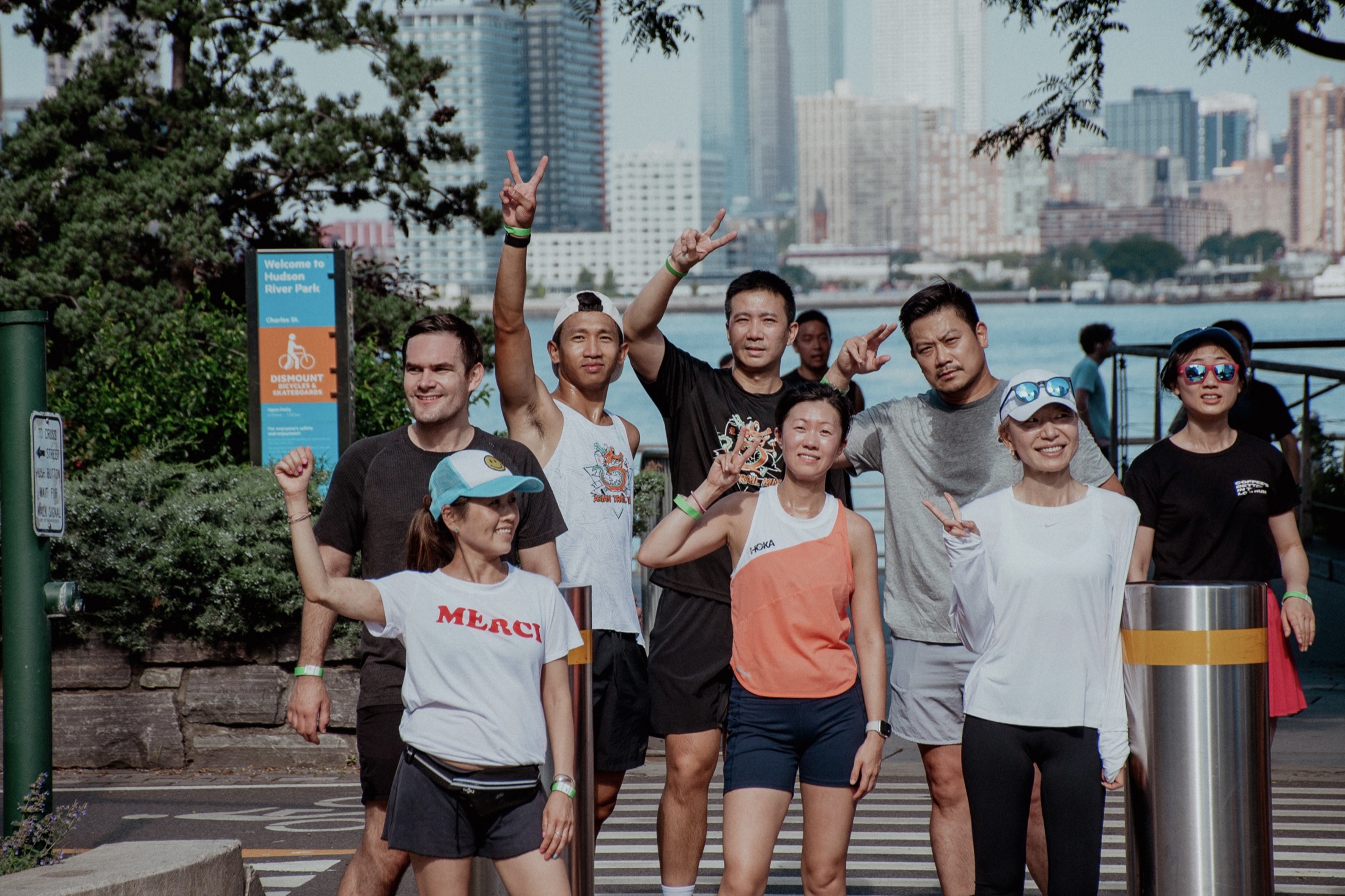 Proof runners gathered together beside the Hudson River